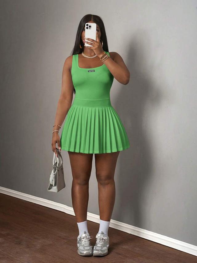 emerald green knitted racerback pleated mini dress