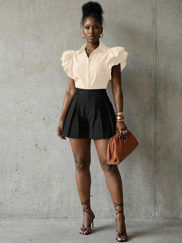 cream oversized black khaki shorts with pleated detailing