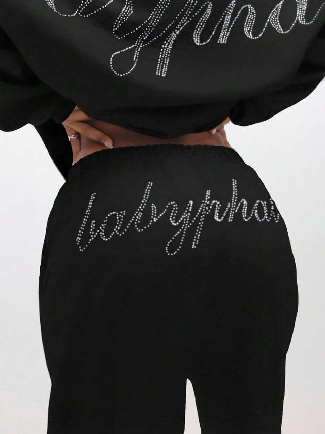 black rhinestone embellished script logo sweatpants