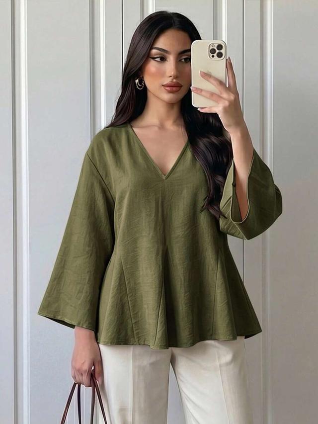 olive green v-neck peplum blouse with flared sleeves