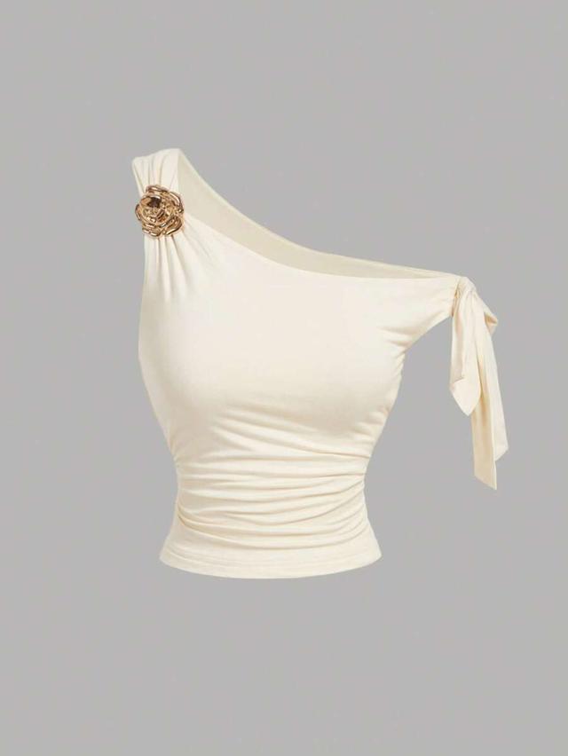 apricot asymmetric one-shoulder top with metallic floral detail
