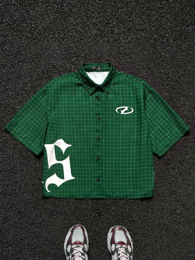 loose fit green plaid woven shirt with graphic print