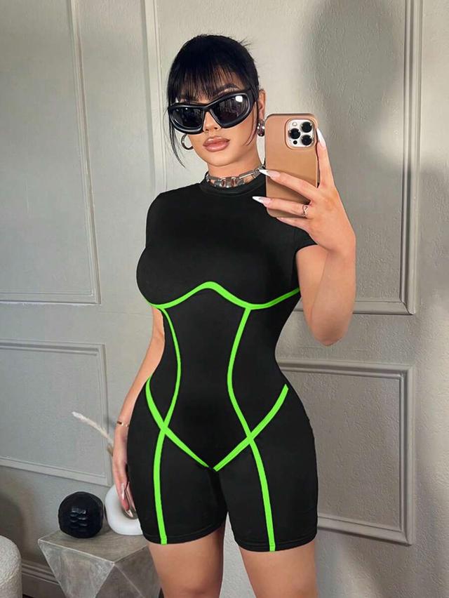 black short sleeve playsuit with neon green piping
