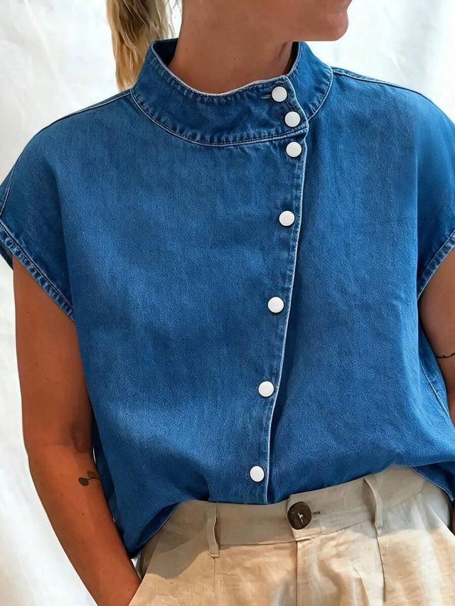 blue denim mock neck button-down sleeveless top