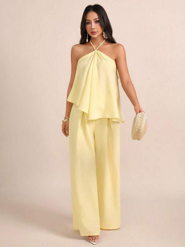 light yellow textured halter tie blouse and wide leg trousers