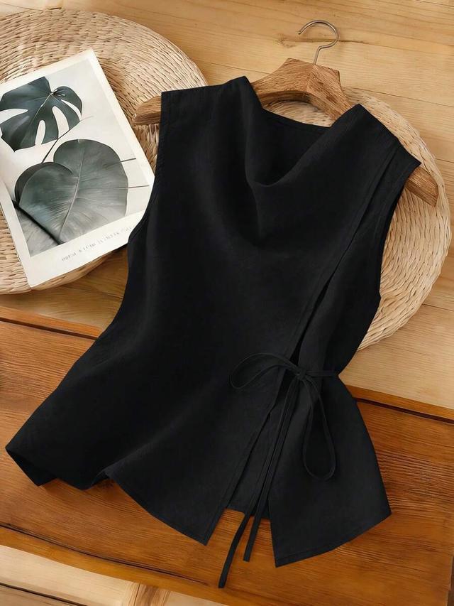 black sleeveless wrap-front tank top with side tie