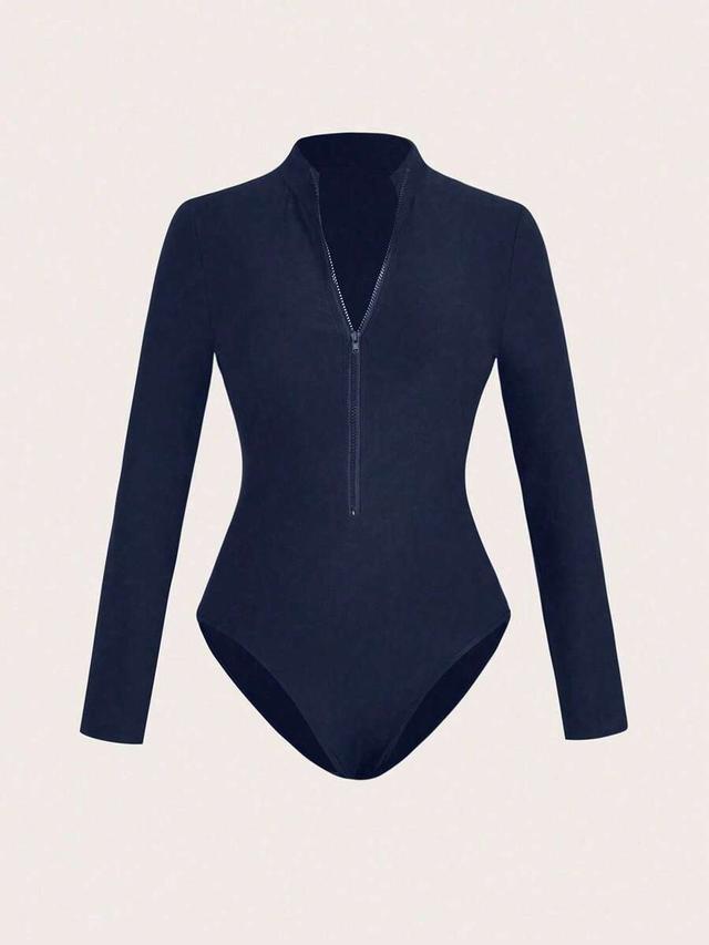 navy stand collar half-zip long sleeve bodysuit