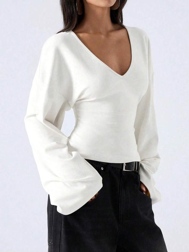minimalist white deep v-neck bell sleeve blouse