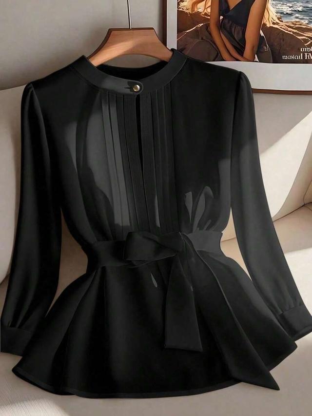 black long sleeve fitted blouse with waist tie