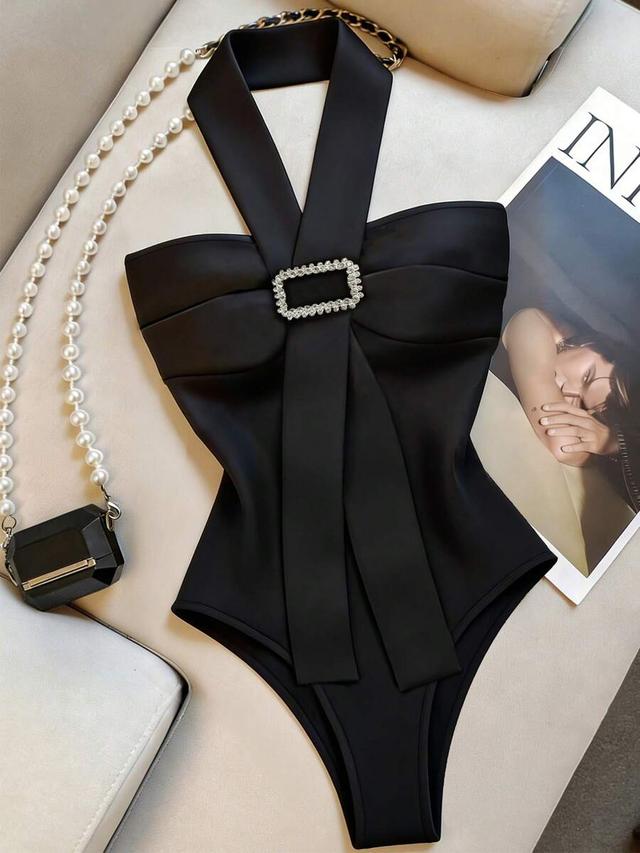 black halter bodysuit with crystal buckle detail