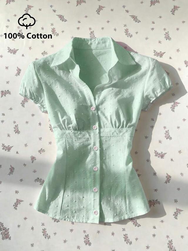 mint green textured jacquard waist cinching short sleeve blouse