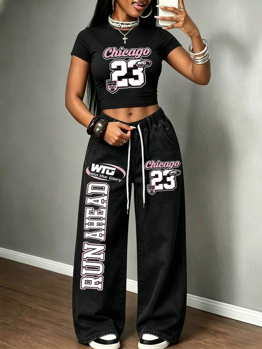 black denim drawstring straight leg jeans with graphic print