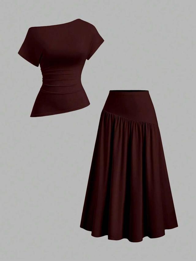 burgundy asymmetric shoulder top and pleated skirt set