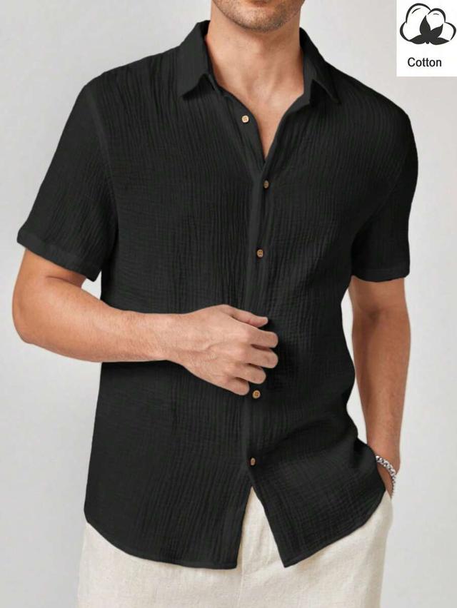black textured cotton short sleeve button up shirt