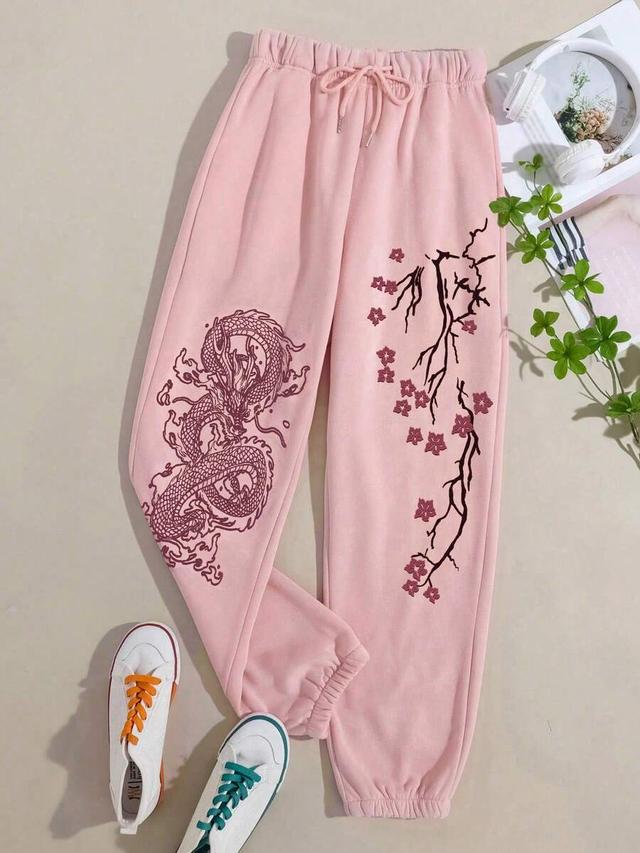 pink drawstring sweatpants with dragon and cherry blossom print