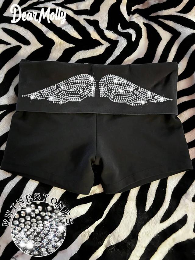 black high waist cuffed shorts with rhinestone wing pattern