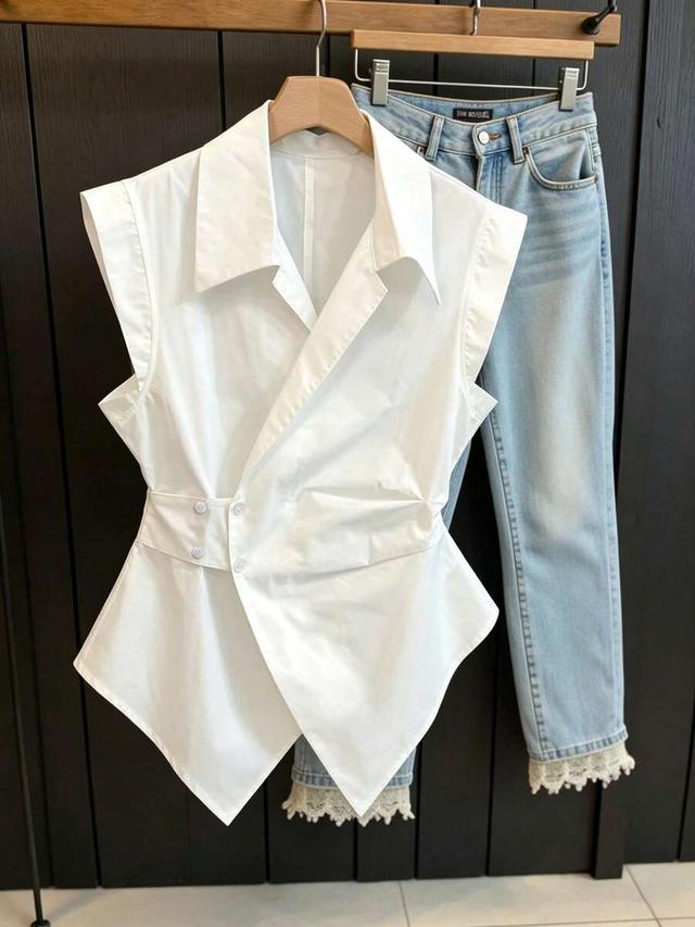 white sleeveless wrap blouse with notched collar