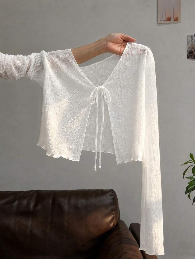 white ruffled long-sleeved textured sun protection top