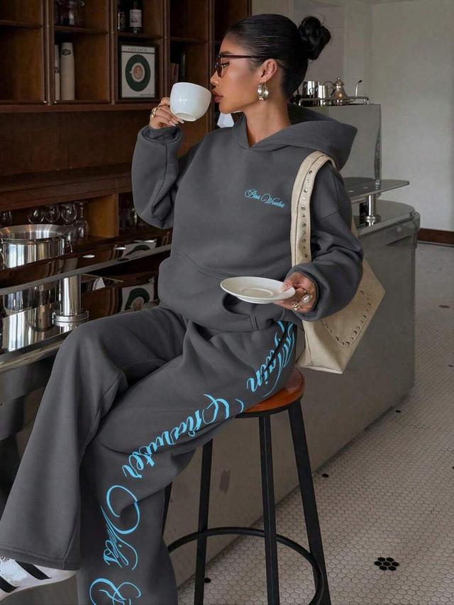 dark grey printed hoodie and matching wide leg trousers