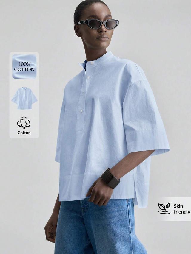 light blue cotton round neck drop shoulder blouse