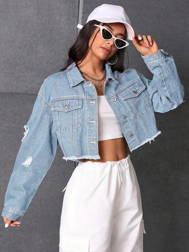 light wash distressed denim cropped jacket with frayed hem