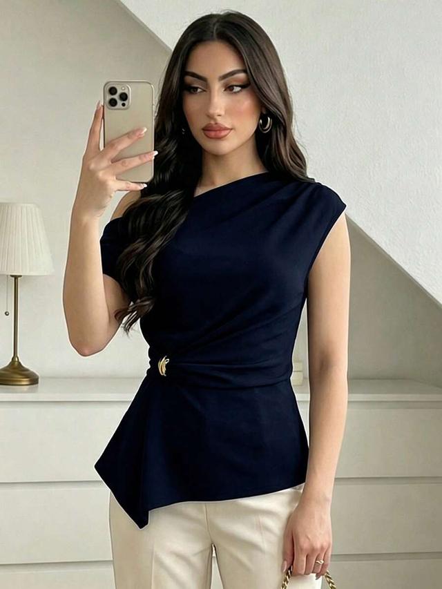 asymmetrical neck textured waist-cinching navy blouse