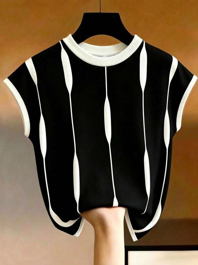 minimalist black and white asymmetrical striped knit top