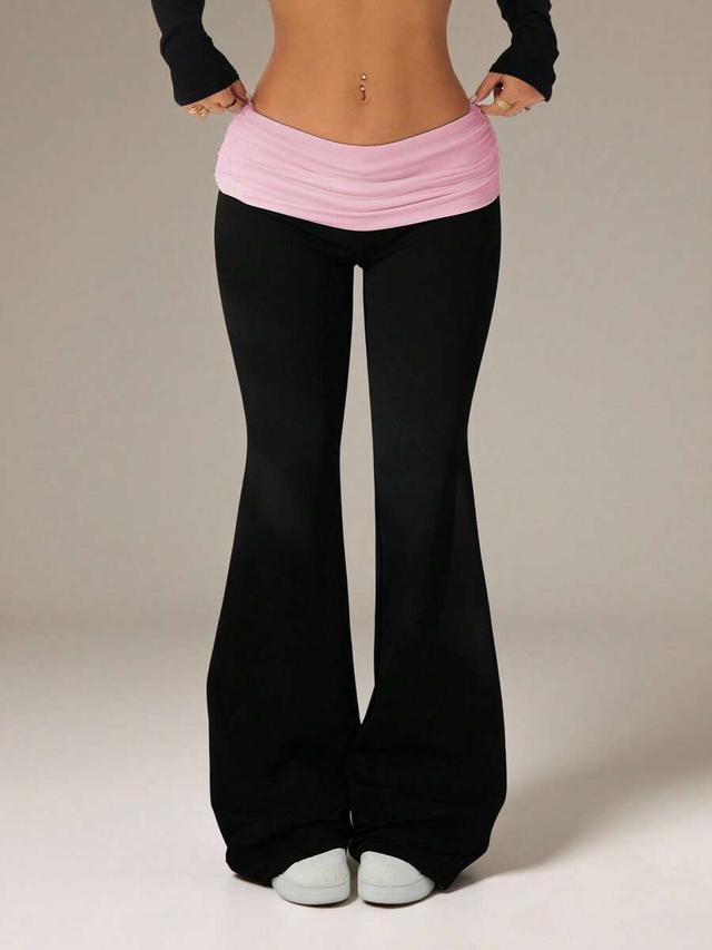 black flare pants with pink fold waist