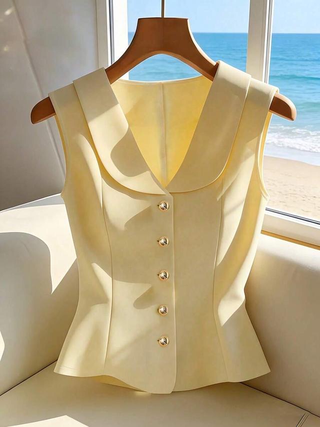 pale yellow sleeveless peplum blouse with collar