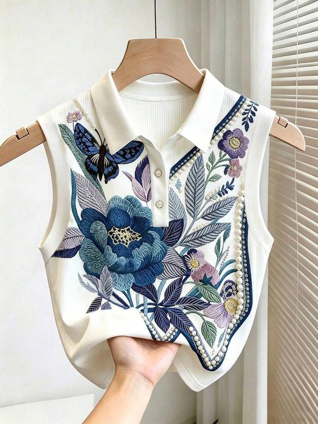white ribbed polo top with floral embroidery and pearls