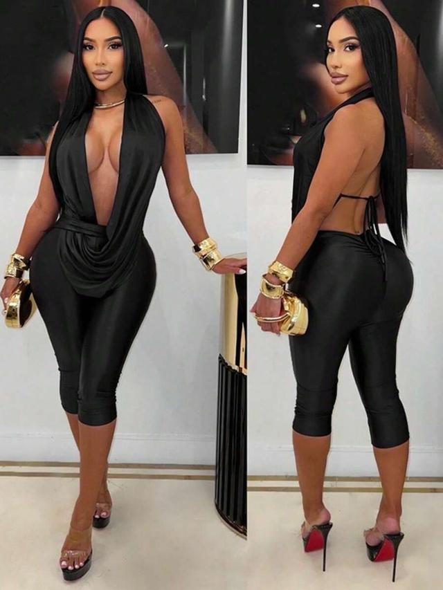 black satin draped halter top and matching capri trousers