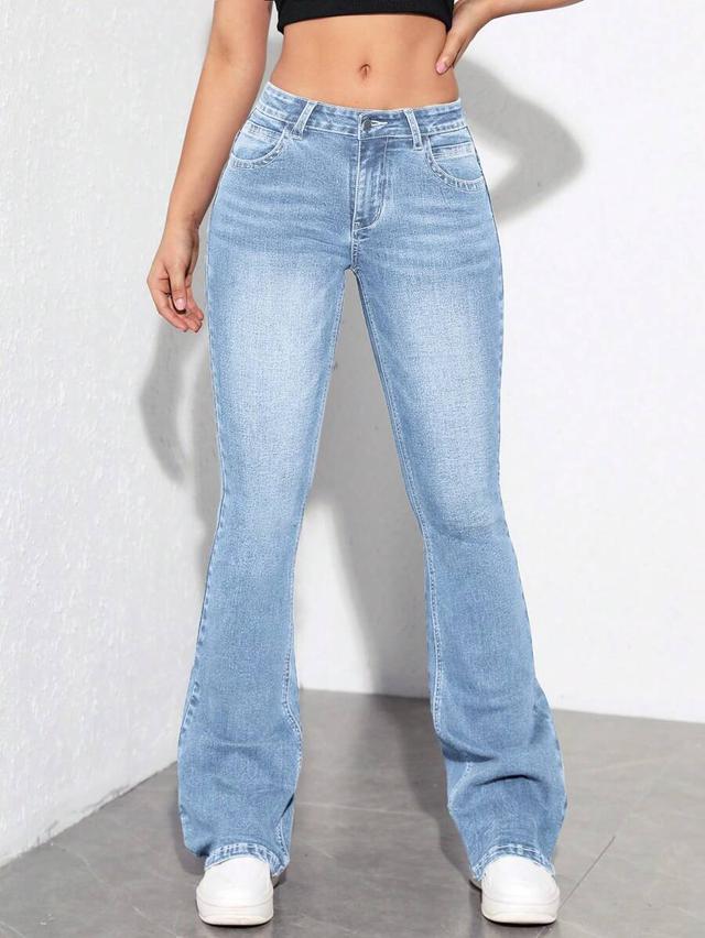 light wash flared denim jeans with pockets