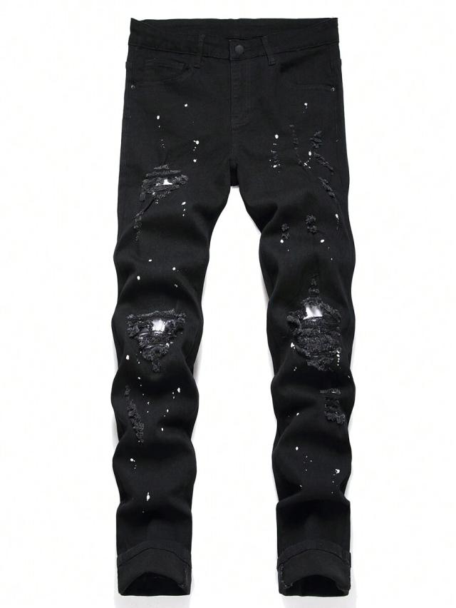 black distressed denim jeans with paint splatter