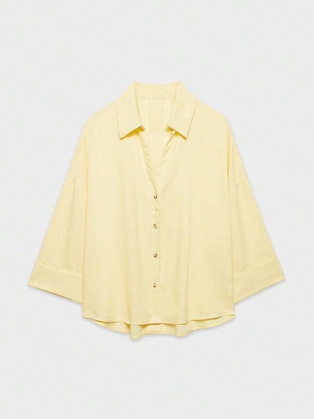 light yellow minimalist loose fit long sleeve blouse