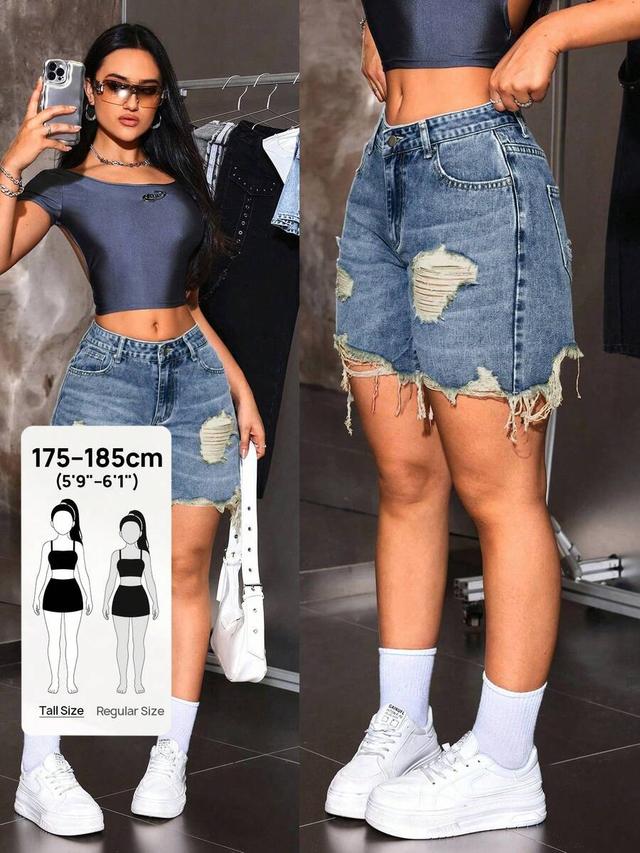 blue distressed medium wash denim shorts with frayed hem