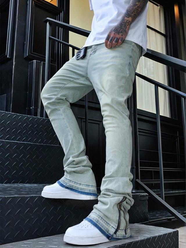 light wash stacked flare denim jeans with ankle zippers