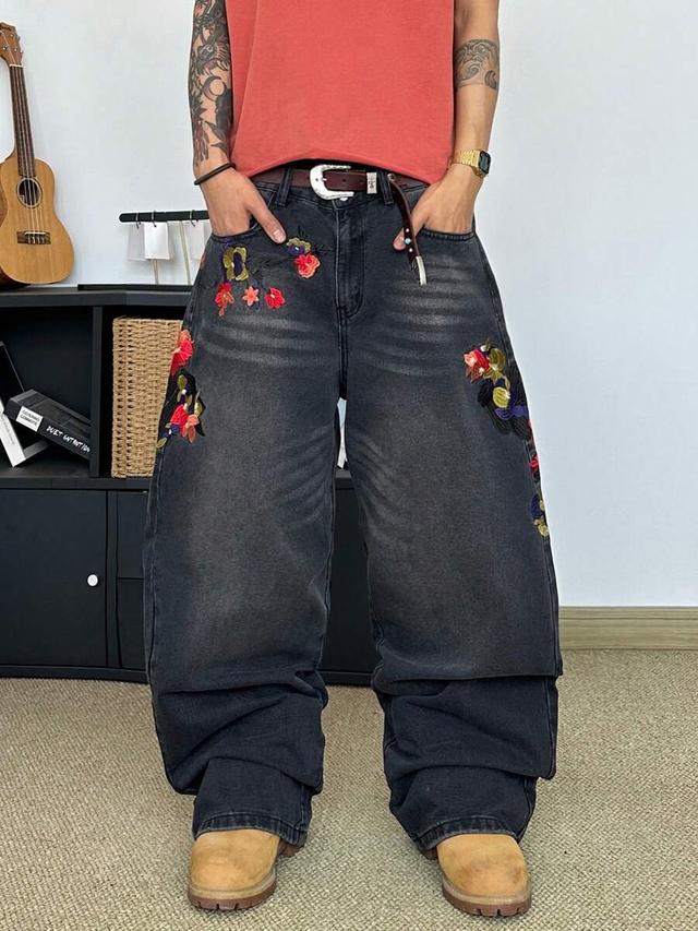 vintage distressed washed denim jeans with floral embroidery