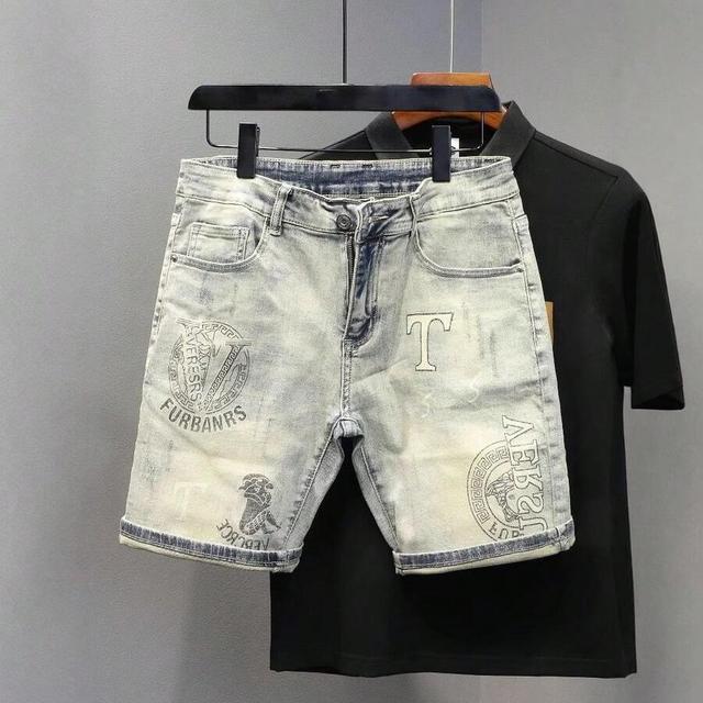 washed distressed light denim printed mid-length shorts