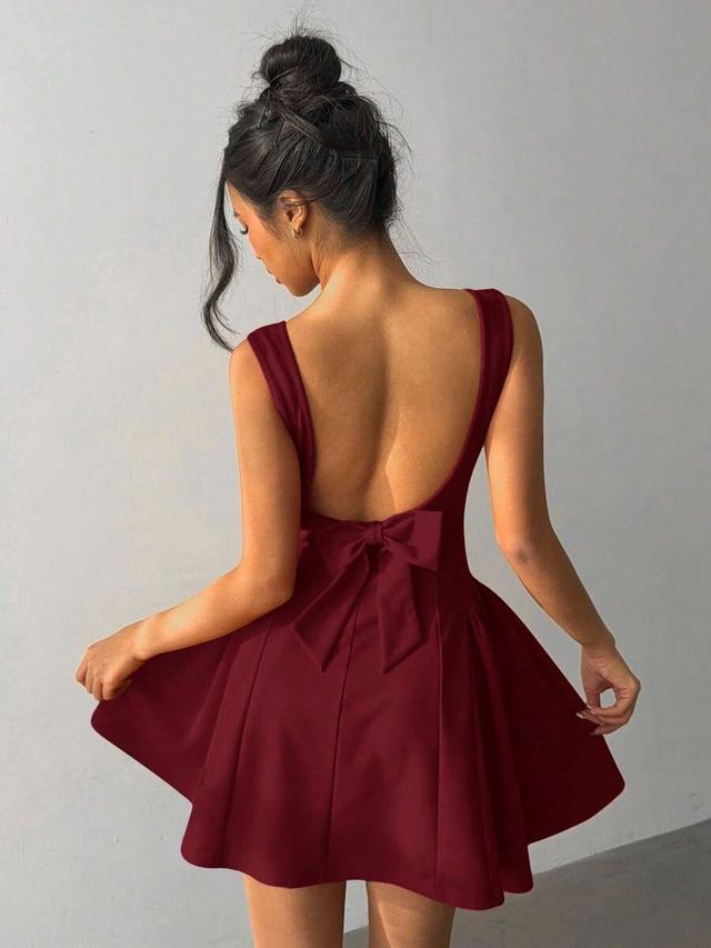 burgundy backless mini dress with bow detail