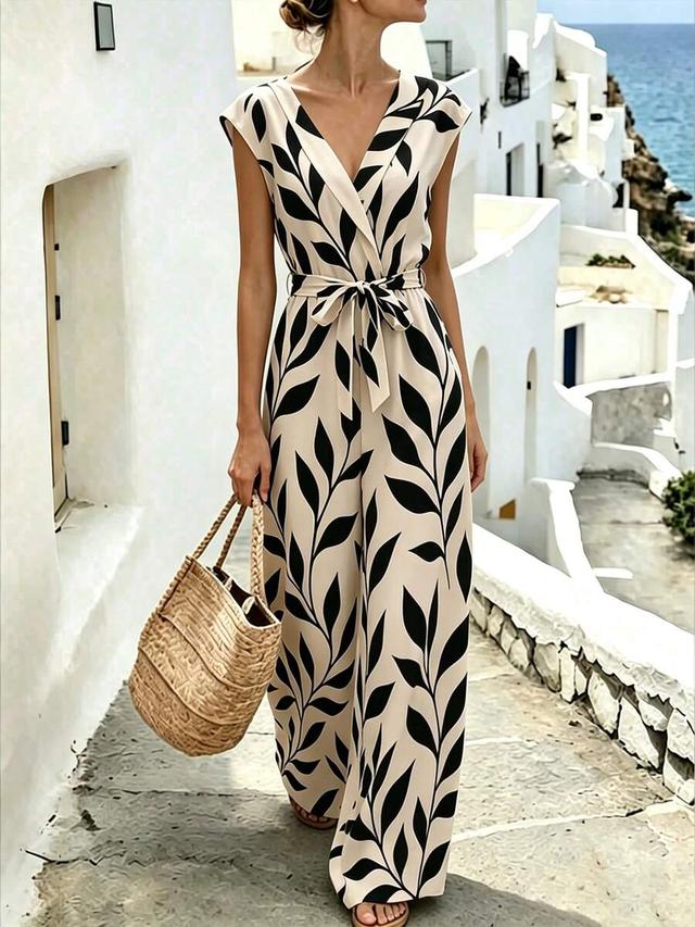 beige and black leaf print wide leg jumpsuit