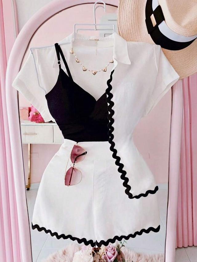 white collared shirt and shorts set with black trim
