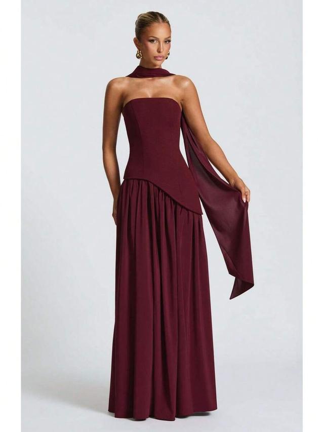 burgundy strapless gown with asymmetric draped bodice
