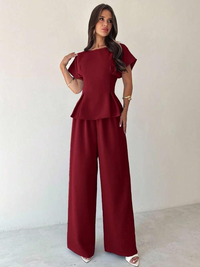 burgundy pleated peplum top with matching wide leg trousers