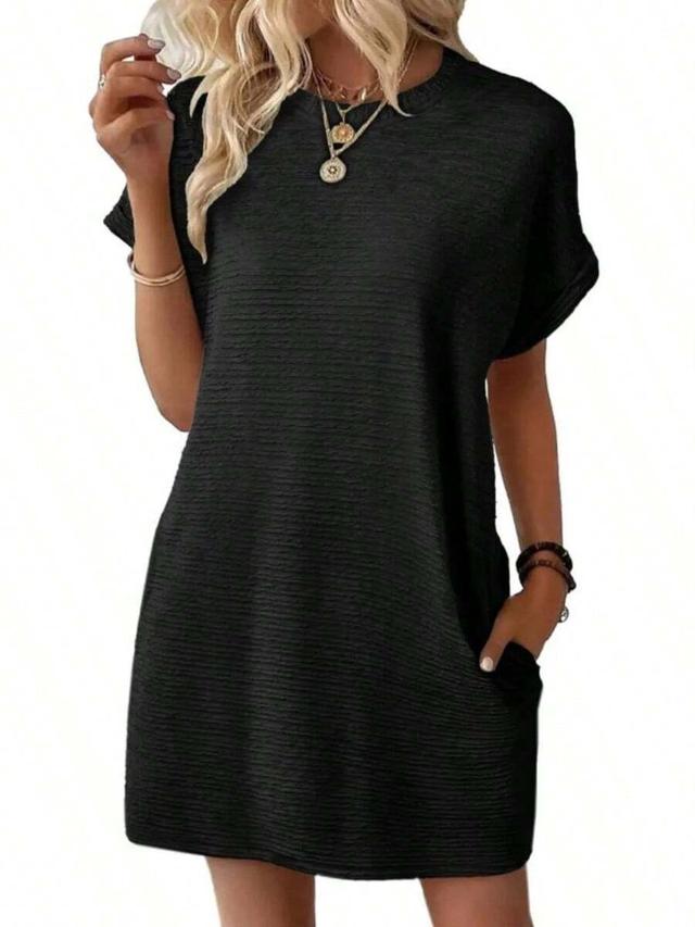 black textured shift dress with pockets