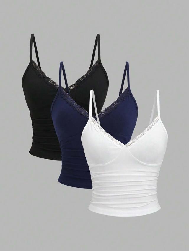 black y2k camisole with lace trim and pleat detail