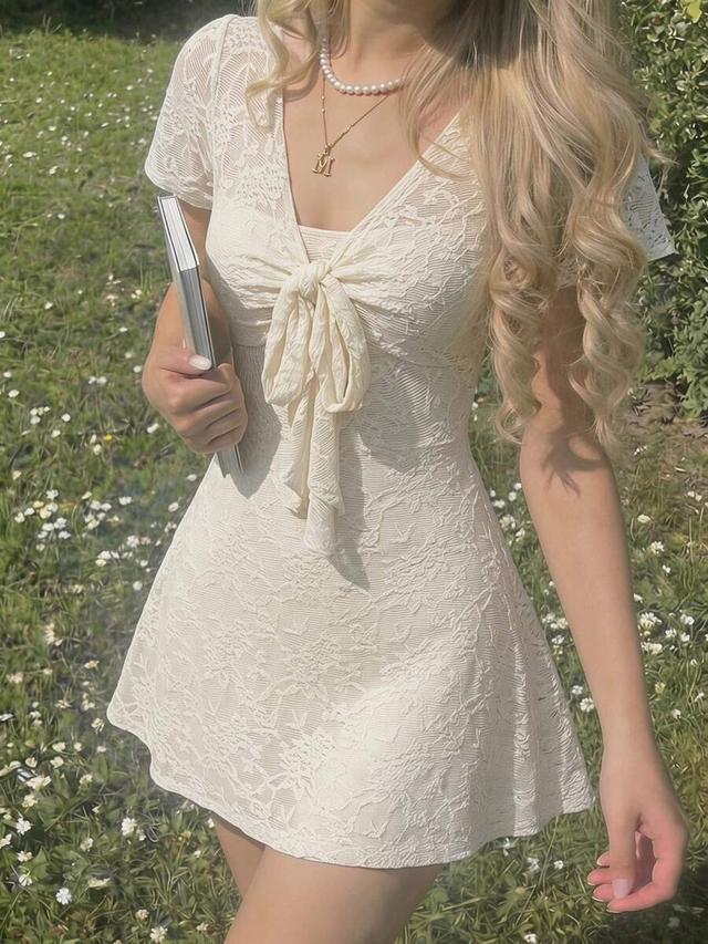 creamy white lace mini dress with tie front