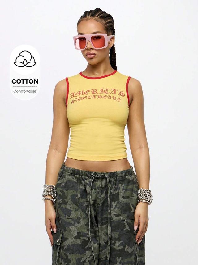 yellow sleeveless cropped tank top with red trim