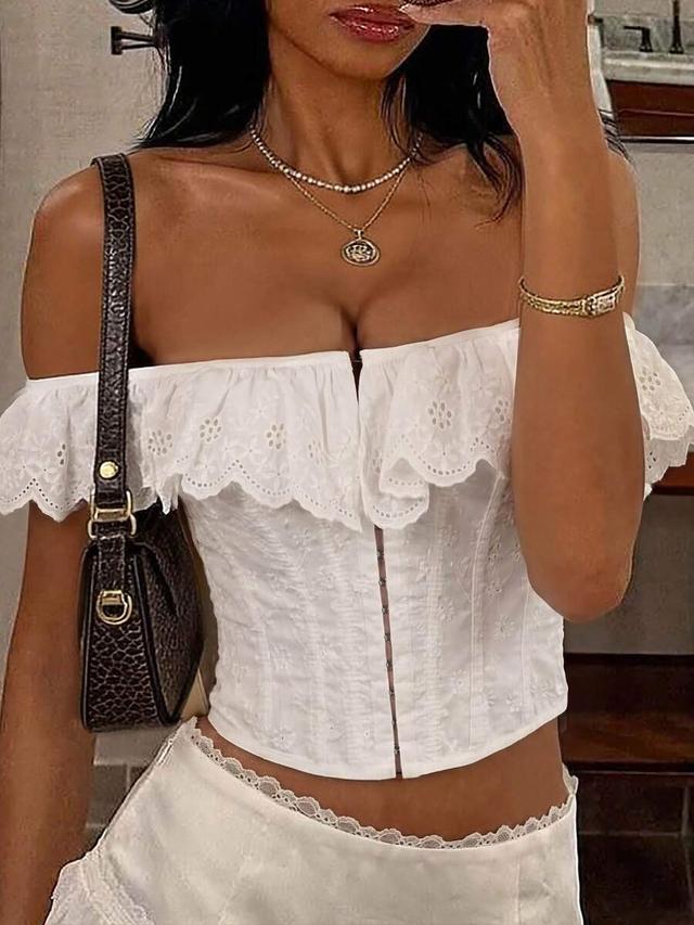 white eyelet corset top with ruffled off-shoulder neckline