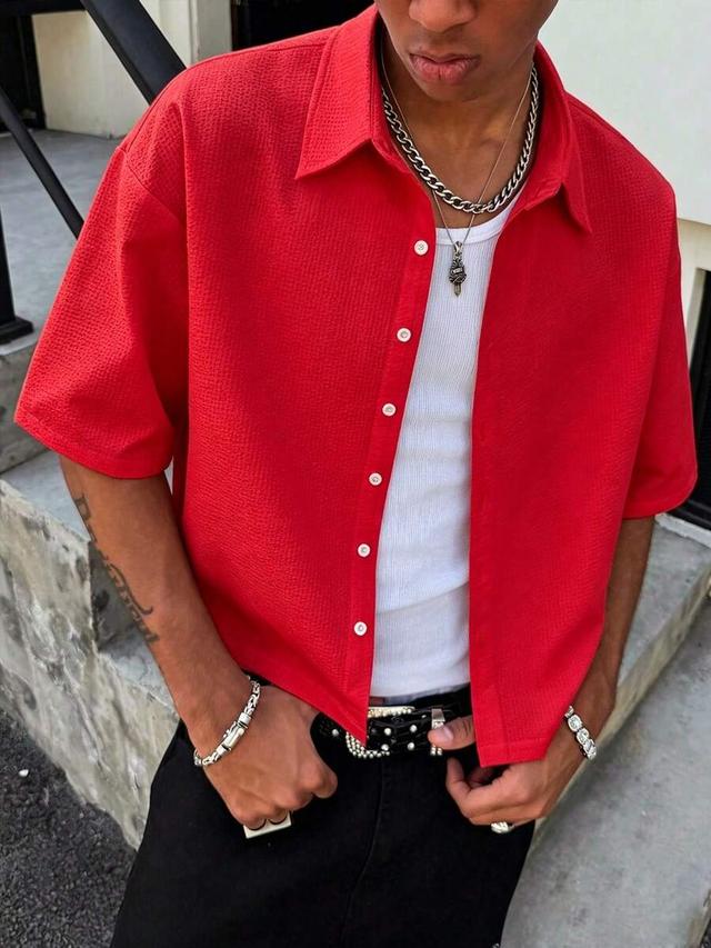 red textured short sleeve casual button-down shirt