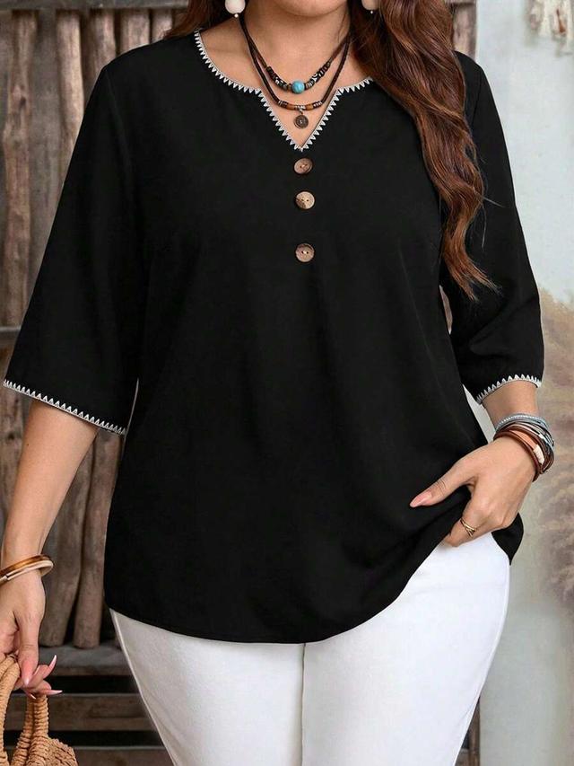 casual minimalist black shirt with contrast shell embroidery